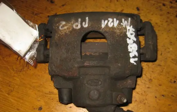 Mazda 121 SM Front brake caliper