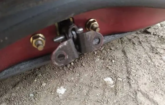 Front door check strap stopper