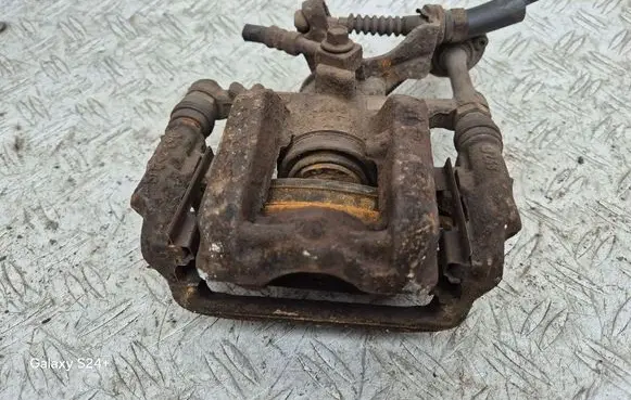 Opel Astra J Rear brake caliper 13345063