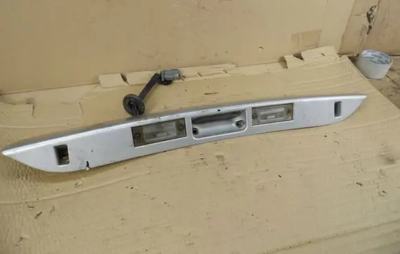Chrysler Voyager Trunk door license plate light bar 