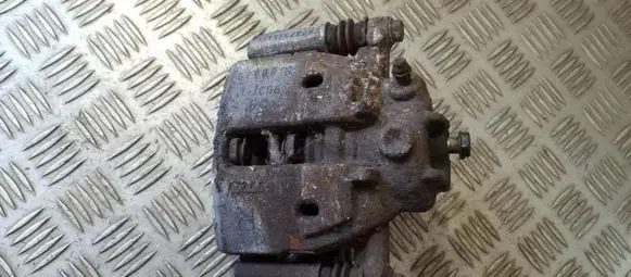 Mitsubishi Colt Front brake caliper 323251545