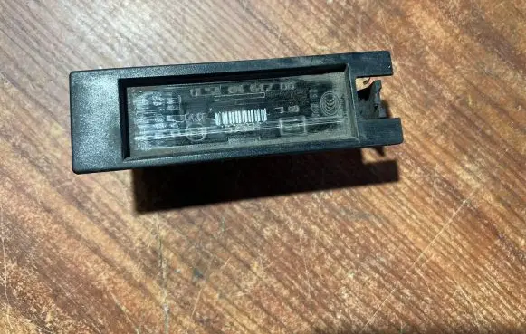 Opel Corsa D Number plate light 0461200