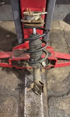 Front shock absorber with coil spring