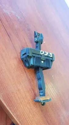 Front door check strap stopper