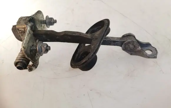 Front door check strap stopper