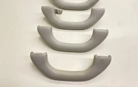 Volkswagen Tiguan A set of handles for the ceiling 1K0857607J 1K0857607H