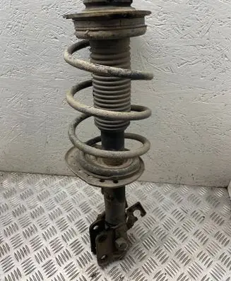 Nissan Juke I F15 Front shock absorber with coil spring 543201ka0b