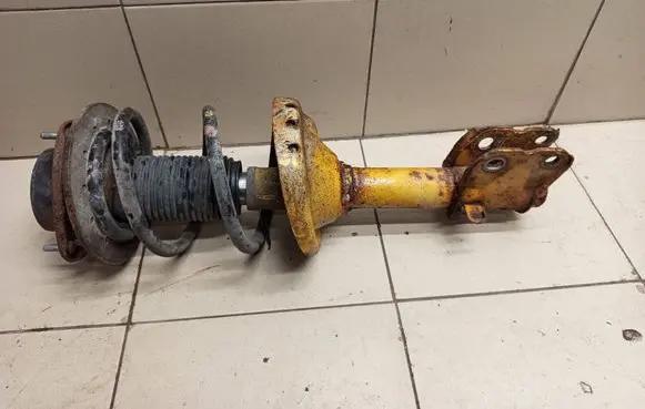 Subaru Legacy Front shock absorber with coil spring 