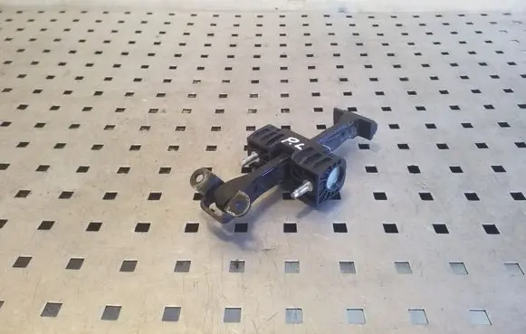 Front door check strap stopper