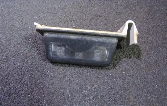 Mazda 323 Number plate light 8245