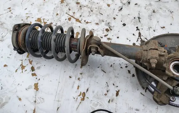Volkswagen Caddy Front shock absorber with coil spring 