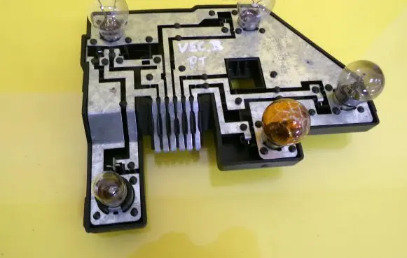 Tail light bulb cover holder