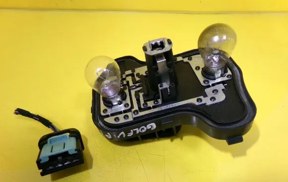Tail light bulb cover holder