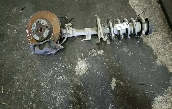 Suzuki Swift I Front shock absorber with coil spring 4160162J12