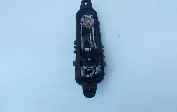 Tail light bulb cover holder