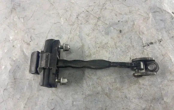 Front door check strap stopper