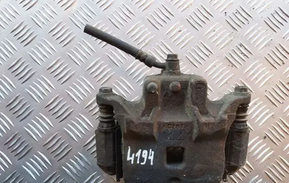 Nissan Juke I F15 Front brake caliper