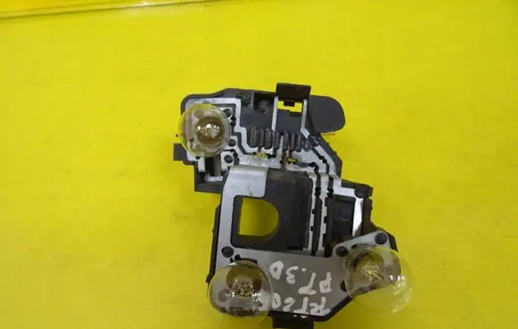 Tail light bulb cover holder