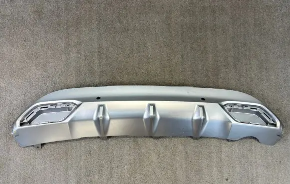 Rear bumper trim bar molding