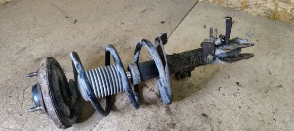 Mitsubishi Lancer VIII Front shock absorber with coil spring
