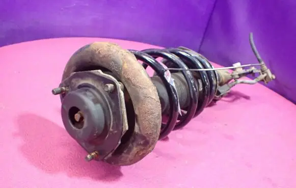 Nissan Primera Front shock absorber with coil spring 452225L