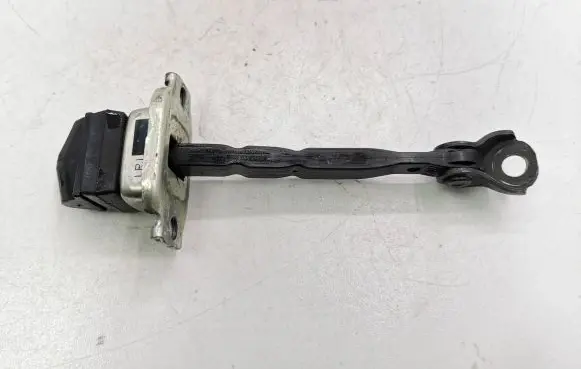 Front door check strap stopper