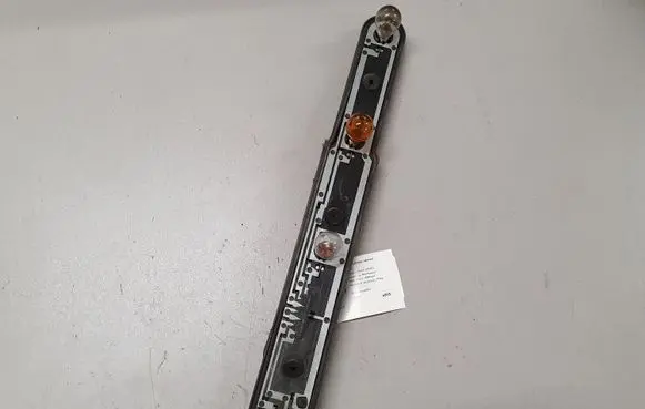Tail light bulb cover holder
