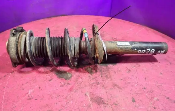 Volkswagen Golf IV Front shock absorber with coil spring 1K0413031BE