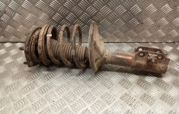 Mazda 323 F Front shock absorber with coil spring