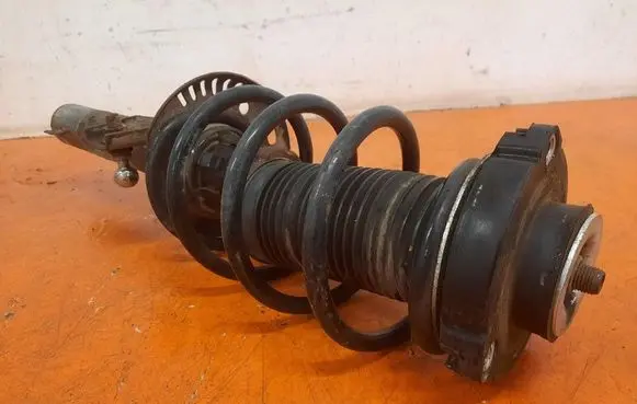 Volkswagen Golf V Front shock absorber with coil spring