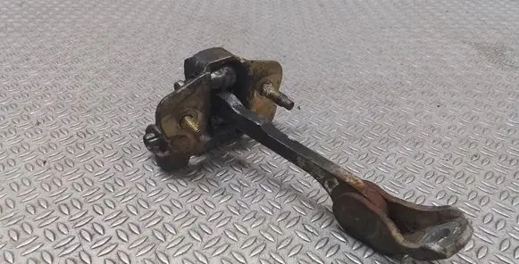Front door check strap stopper