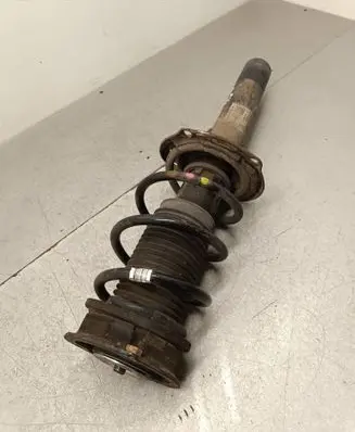 Front shock absorber with coil spring