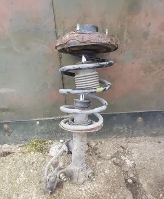 Nissan Primera Front shock absorber with coil spring