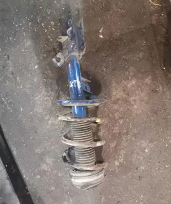 Nissan X-Trail T31 Front shock absorber with coil spring