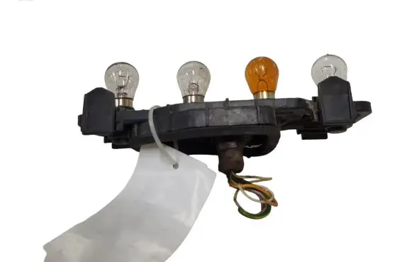 Tail light bulb cover holder