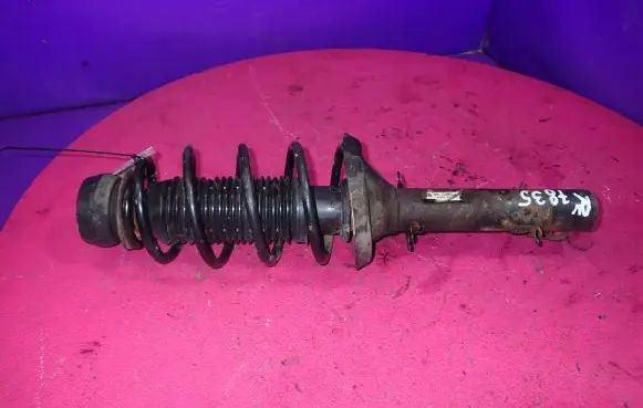Volkswagen Golf IV Front shock absorber with coil spring 1J0413031S