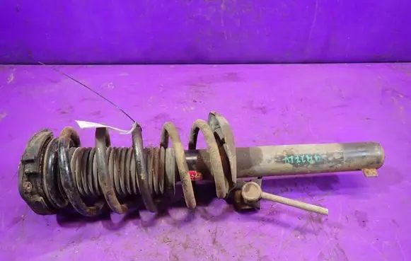 Volkswagen Caddy Front shock absorber with coil spring 
