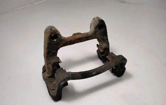 Volkswagen PASSAT B6 Brake caliper pad carrier rear 