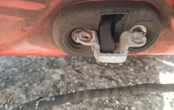 Front door check strap stopper