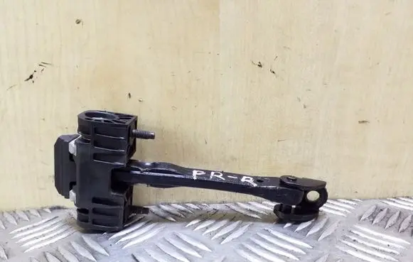 Front door check strap stopper