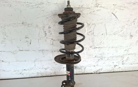 Toyota Yaris Front shock absorber with coil spring