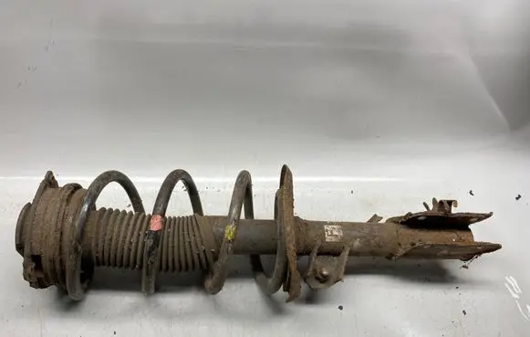 Nissan X-Trail T31 Front shock absorber with coil spring