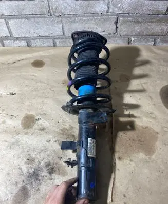 Ford Focus Front shock absorber with coil spring BV6118045LBB 07062346 E5632602