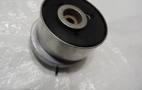 Opel Astra H Timing belt tensioner 55574864