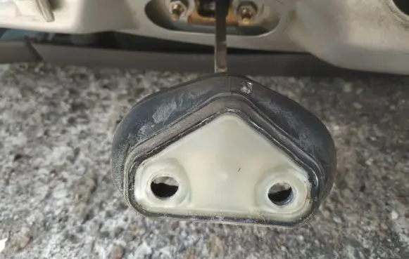 Front door check strap stopper