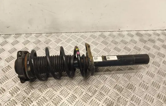 Volkswagen Caddy Front shock absorber with coil spring 1K0413031BA