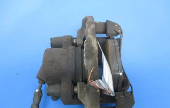 Mazda 323 F Front brake caliper
