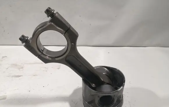 Piston with connecting rod