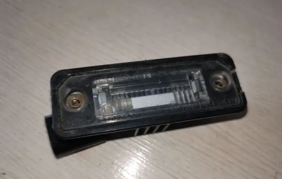Volkswagen Golf V Number plate light 1J6943021B