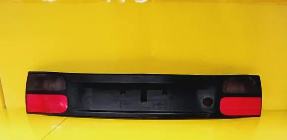 Renault Laguna I Trunk door license plate light bar 7700820049